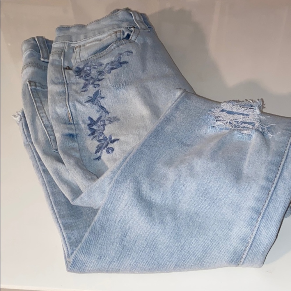 Ripped and frayed embroidered jeans